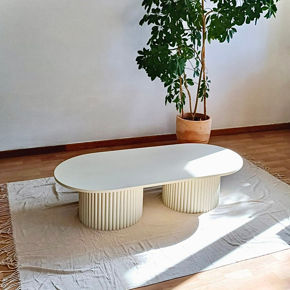 
                  
                    oblong coffee table on 2 fluted bases in light beige
                  
                