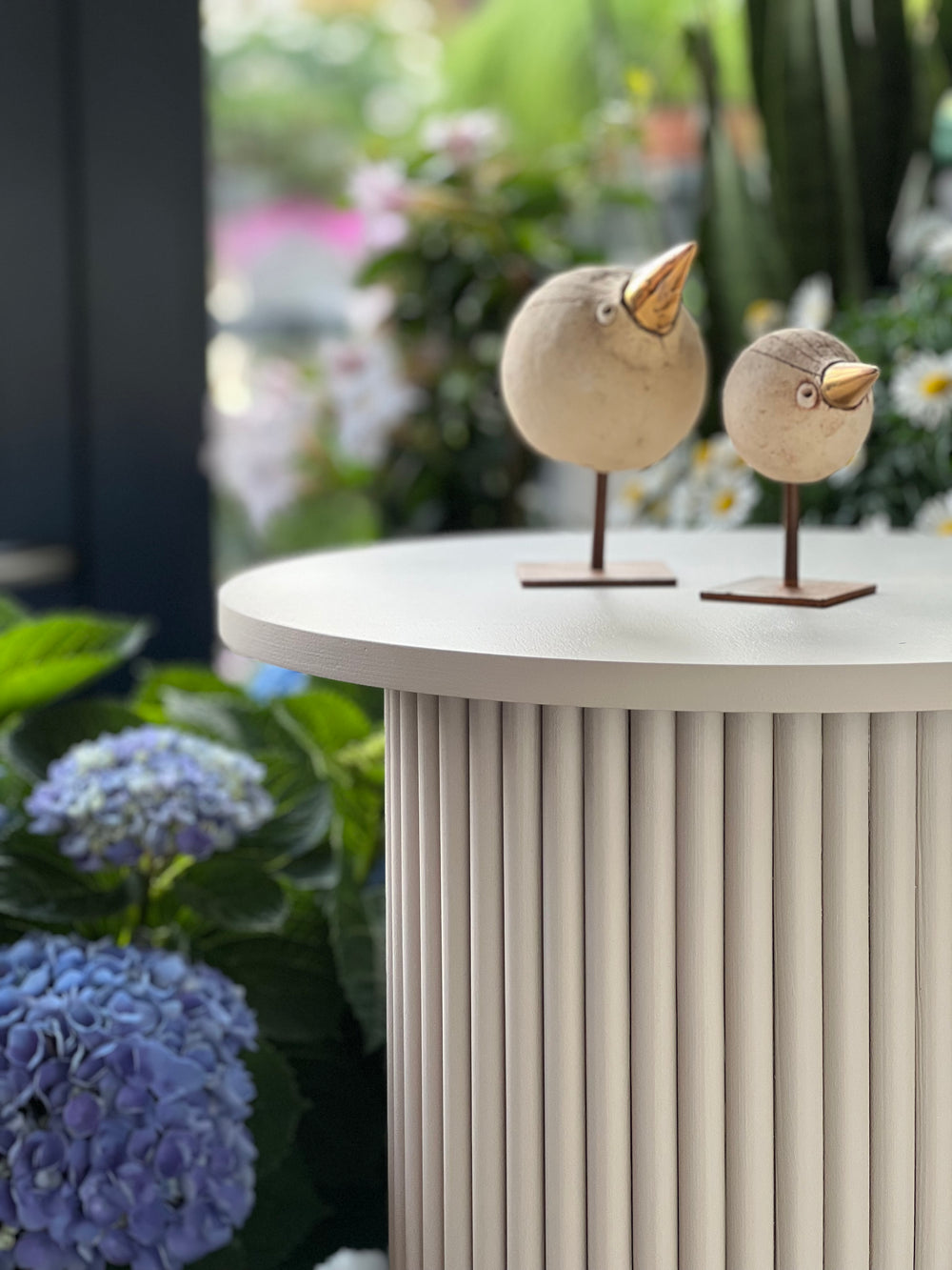 round and fluted bedside table in beige, cafe latte color