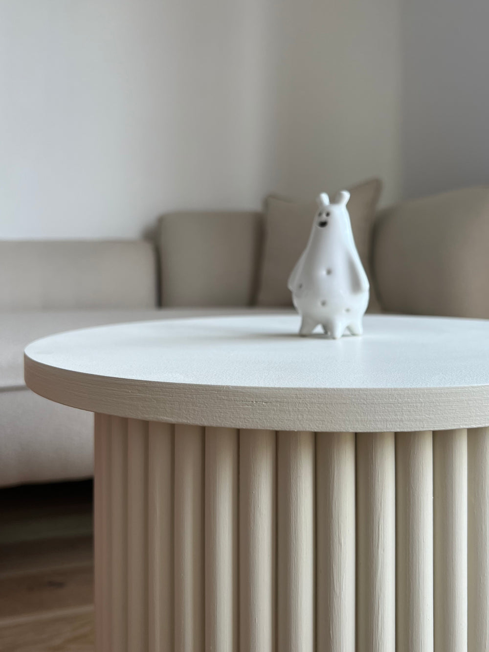 round and fluted bedside table in light beige