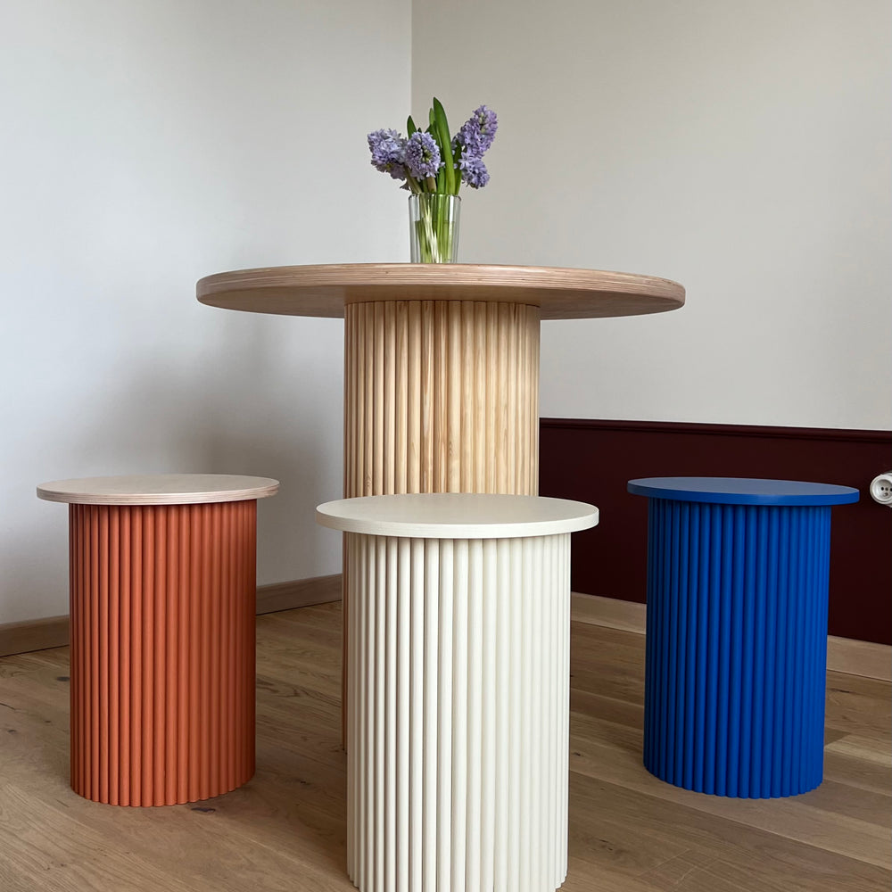 
                  
                    round and fluted bedside table in light beige
                  
                