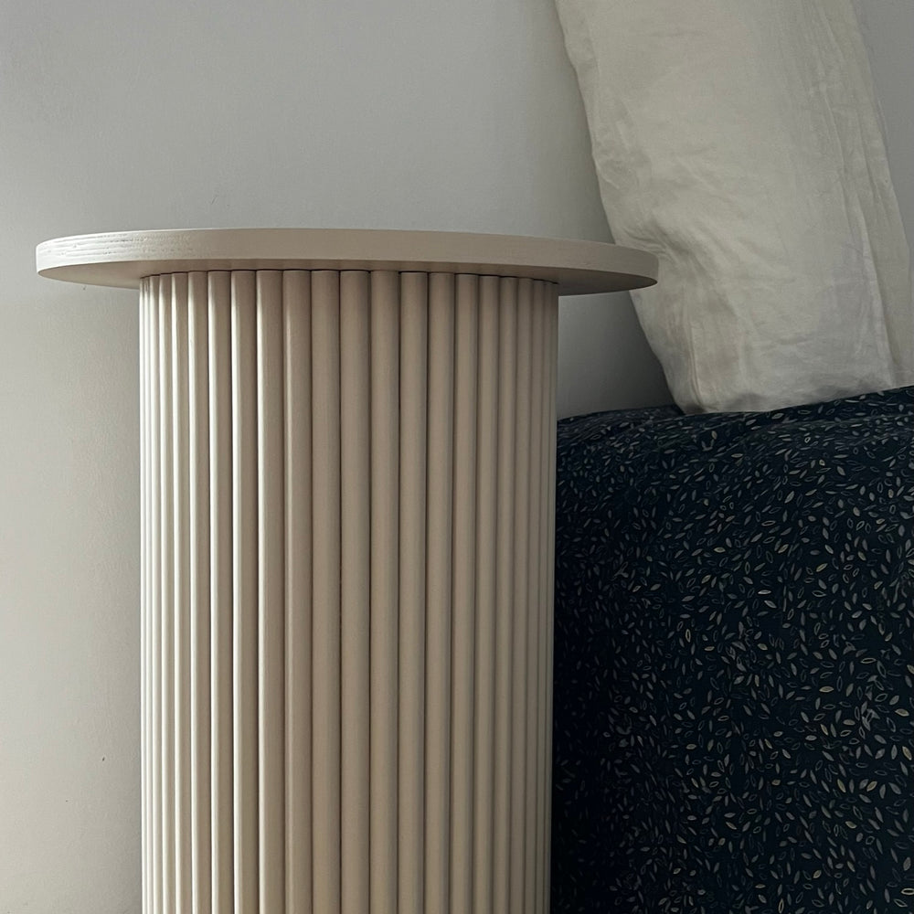 
                  
                    round and fluted bedside table in beige, cafe latte color
                  
                