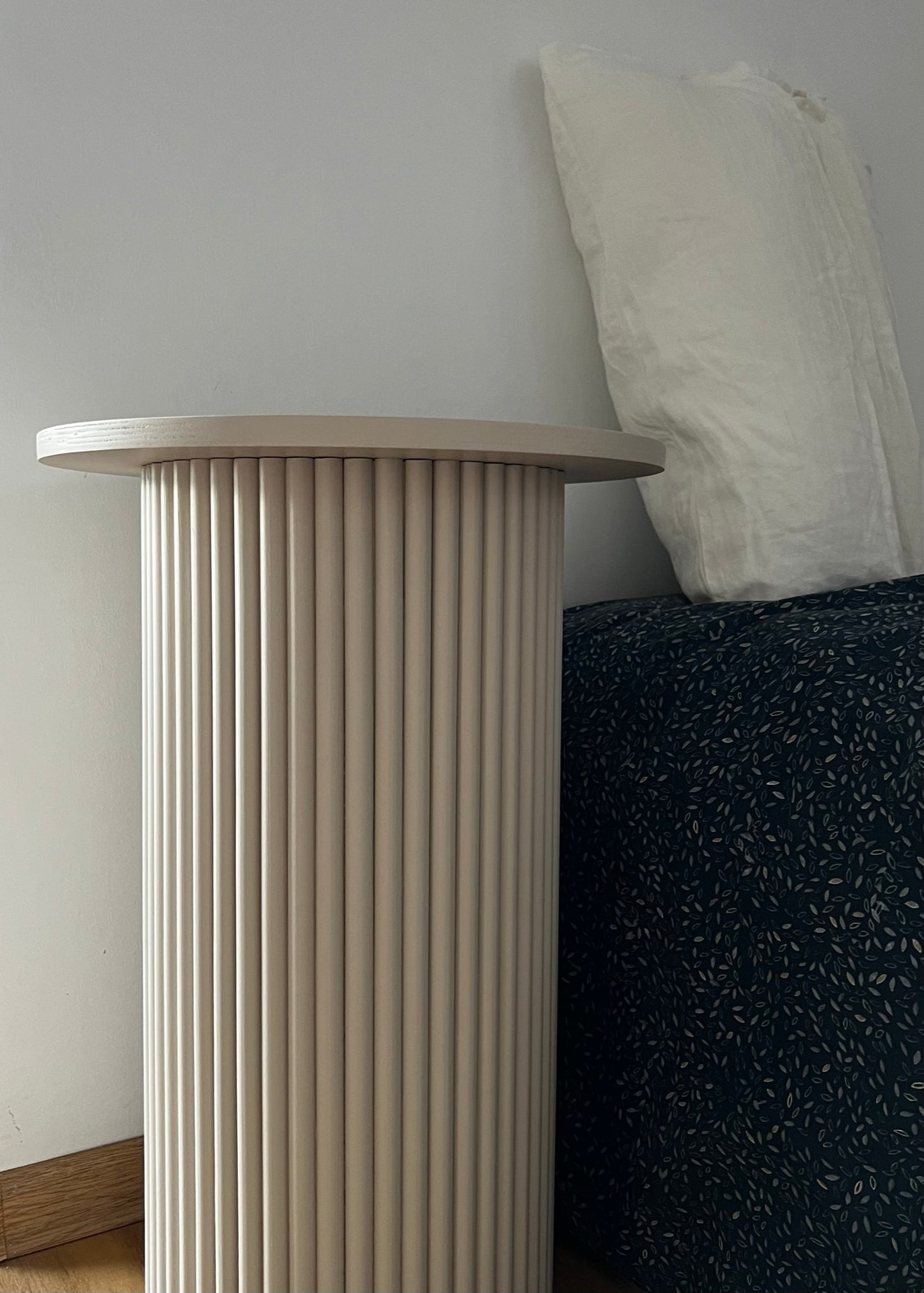 
                  
                    round and fluted bedside table in beige, cafe latte color
                  
                