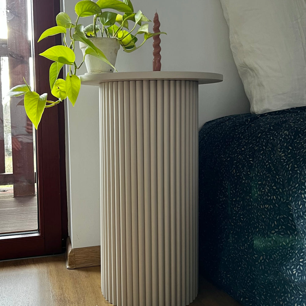 
                  
                    round and fluted bedside table in beige, cafe latte color
                  
                