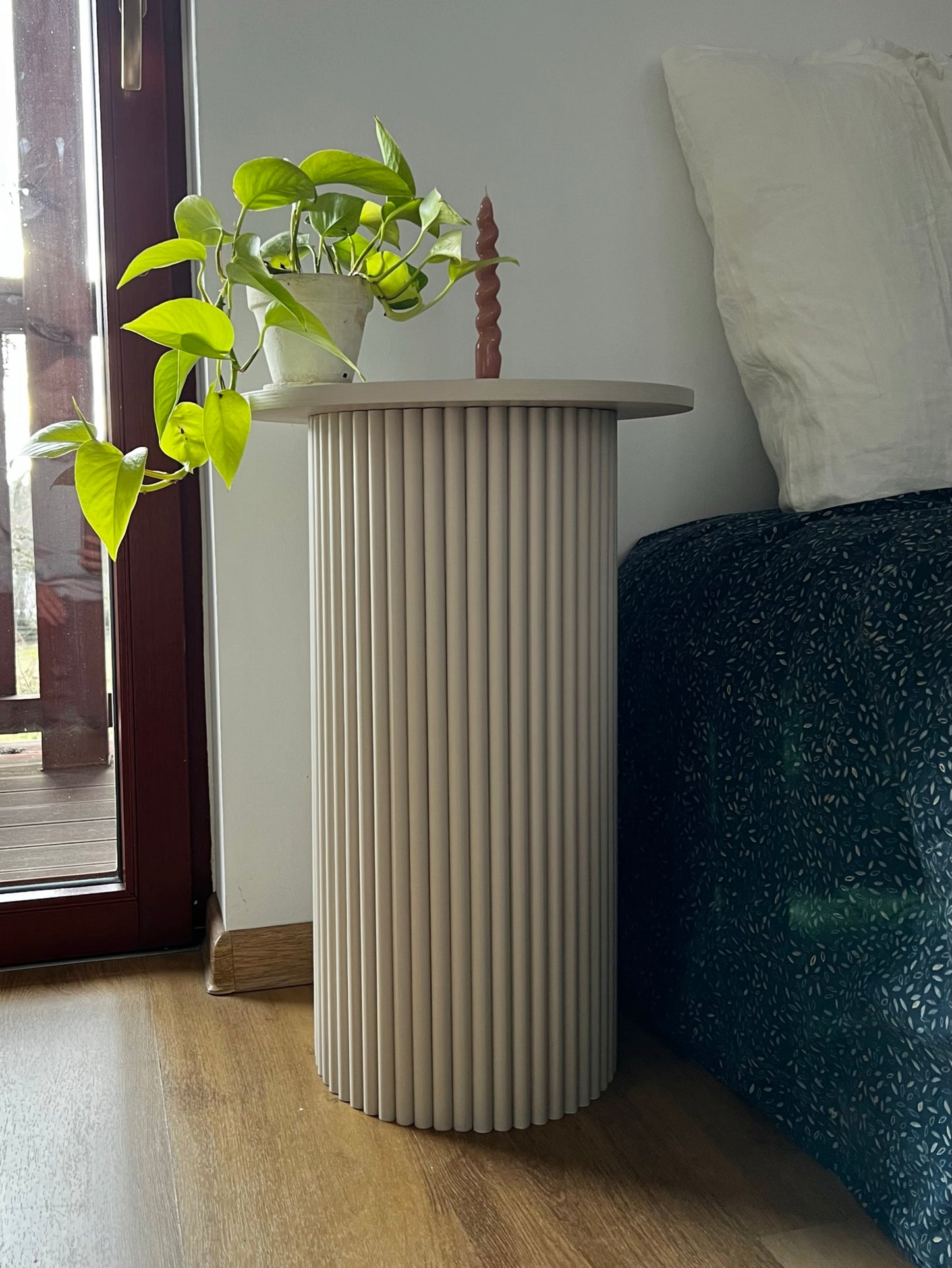 
                  
                    round and fluted bedside table in beige, cafe latte color
                  
                