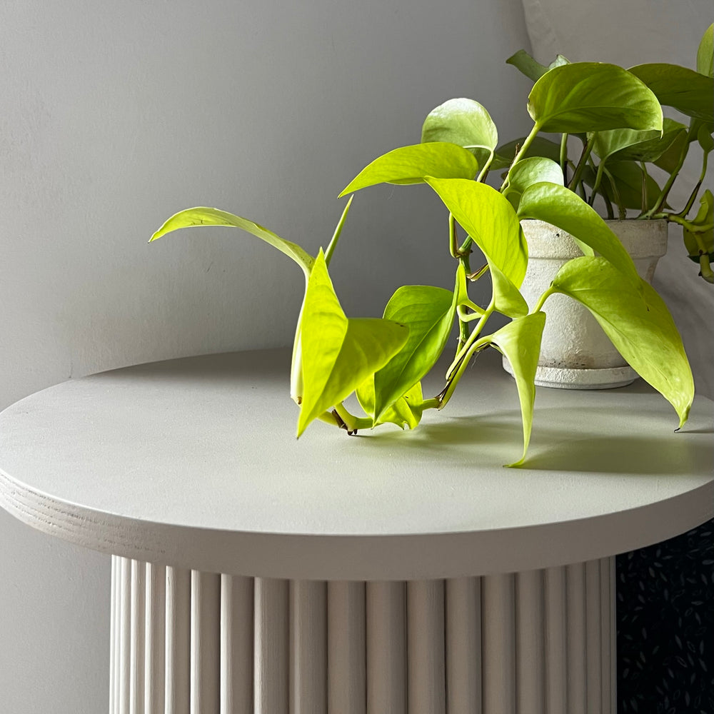 
                  
                    round and fluted bedside table in beige, cafe latte color
                  
                