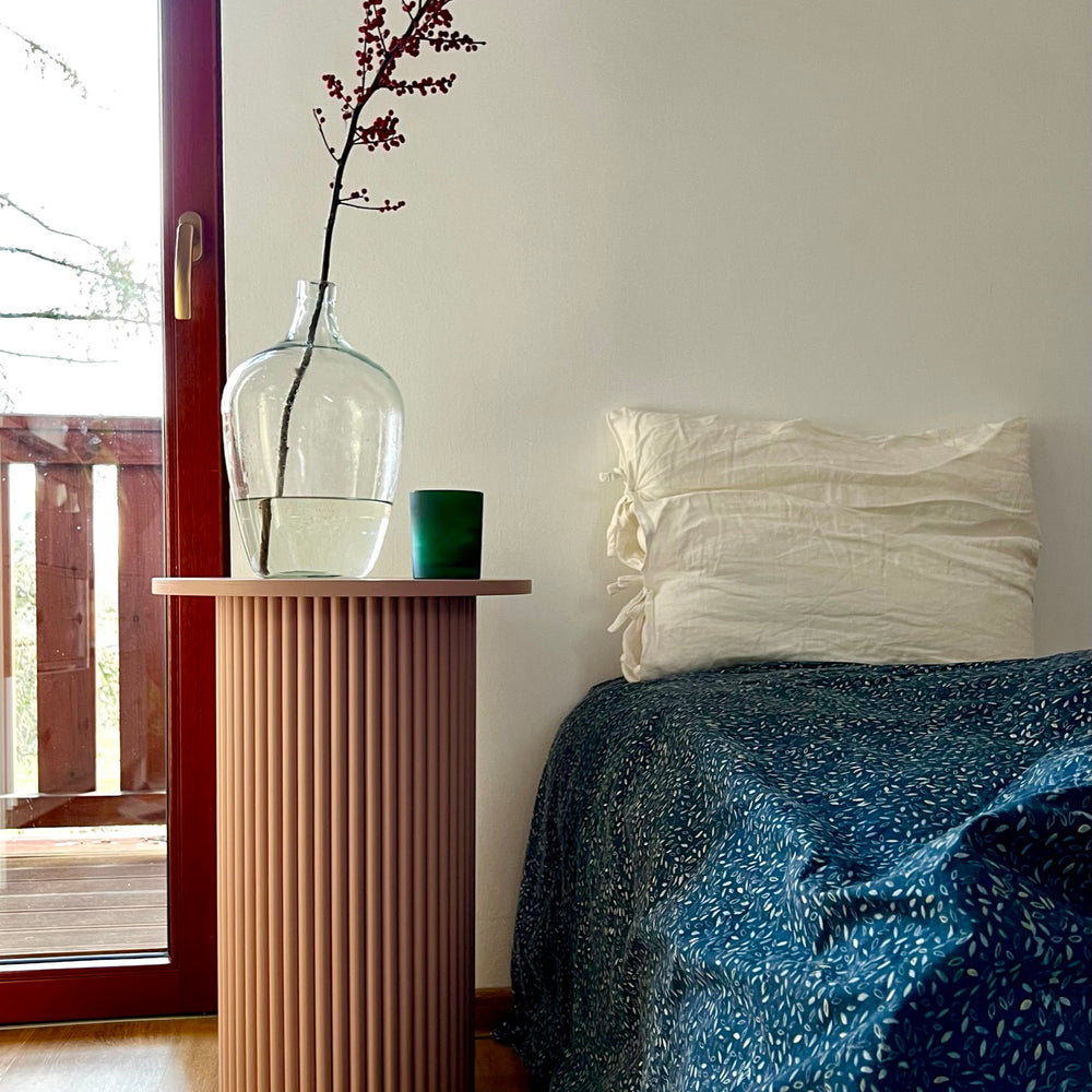 
                  
                    round and fluted bedside table in dusty pink
                  
                