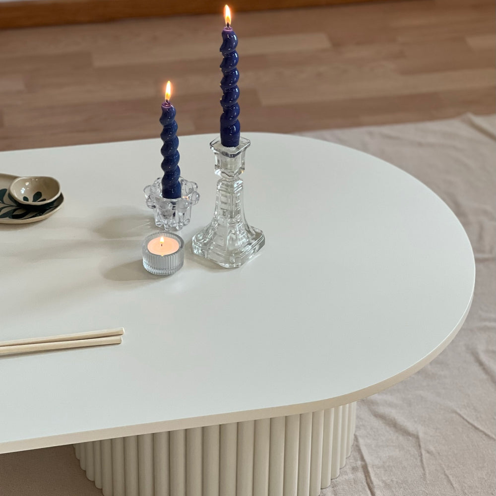 
                  
                    oblong coffee table on 2 fluted bases in light beige
                  
                