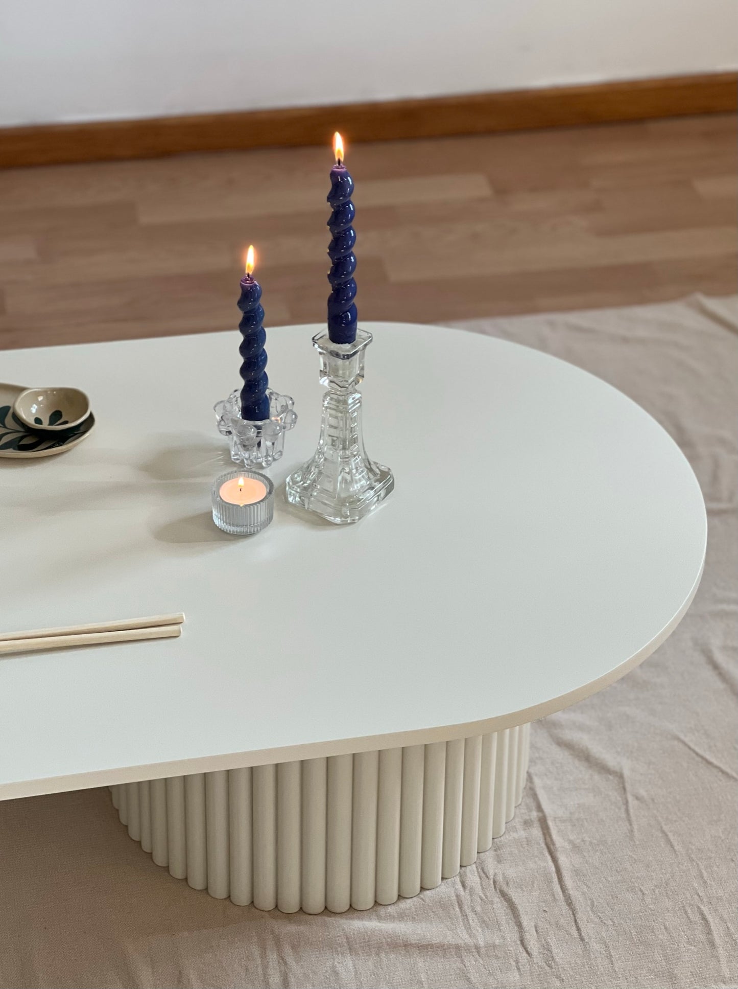 
                  
                    oblong coffee table on 2 fluted bases in light beige
                  
                