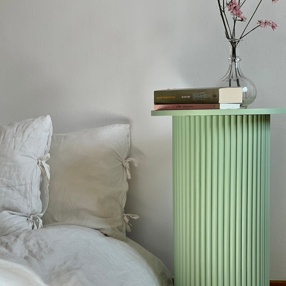 
                  
                    round and fluted bedside table in sage green
                  
                