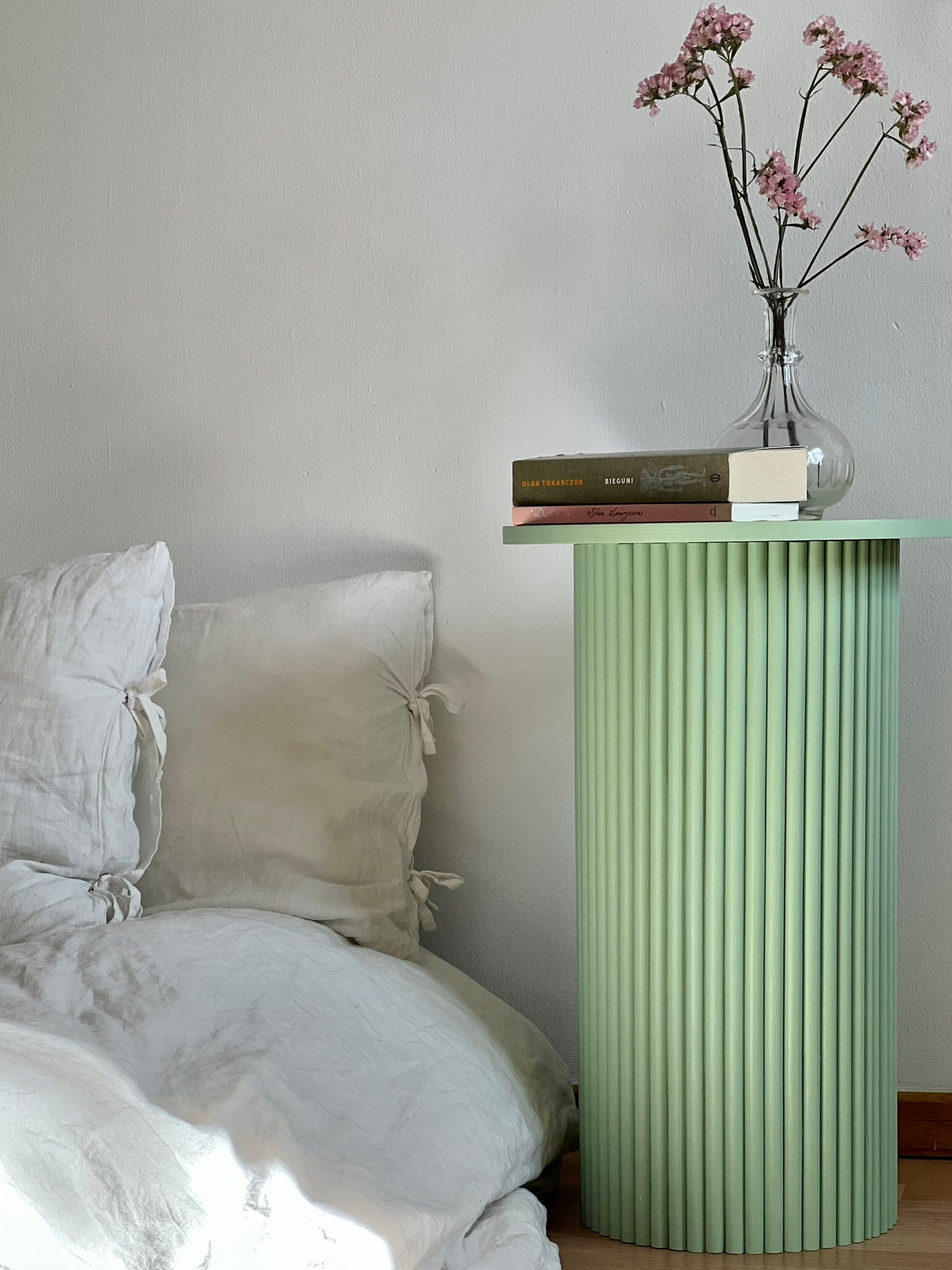 
                  
                    round and fluted bedside table in sage green
                  
                