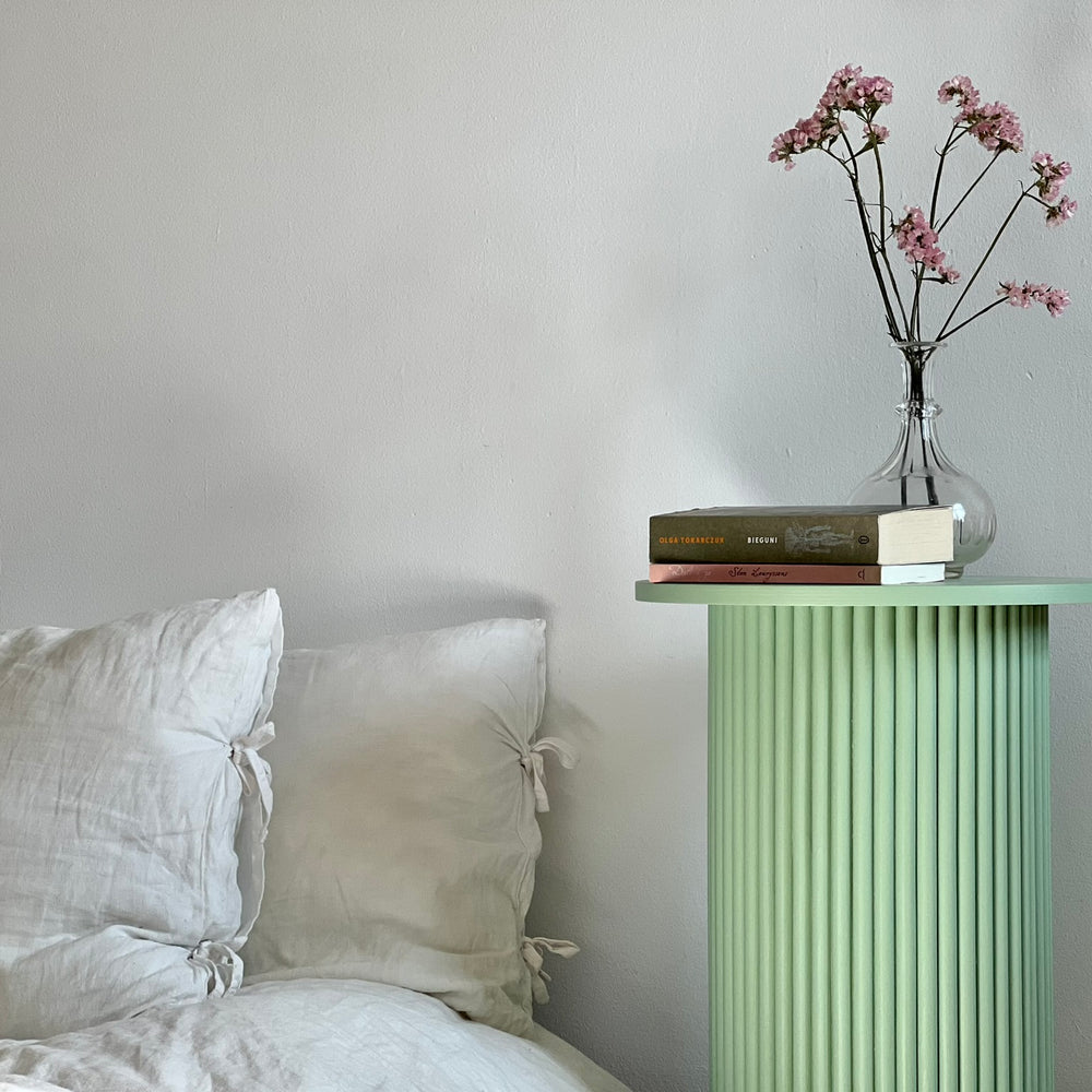 
                  
                    round and fluted bedside table in sage green
                  
                