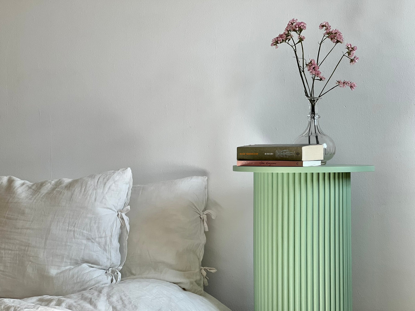 
                  
                    round and fluted bedside table in sage green
                  
                