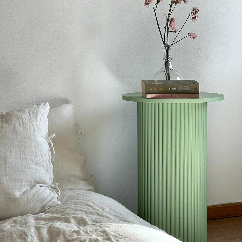 
                  
                    round and fluted bedside table in sage green
                  
                