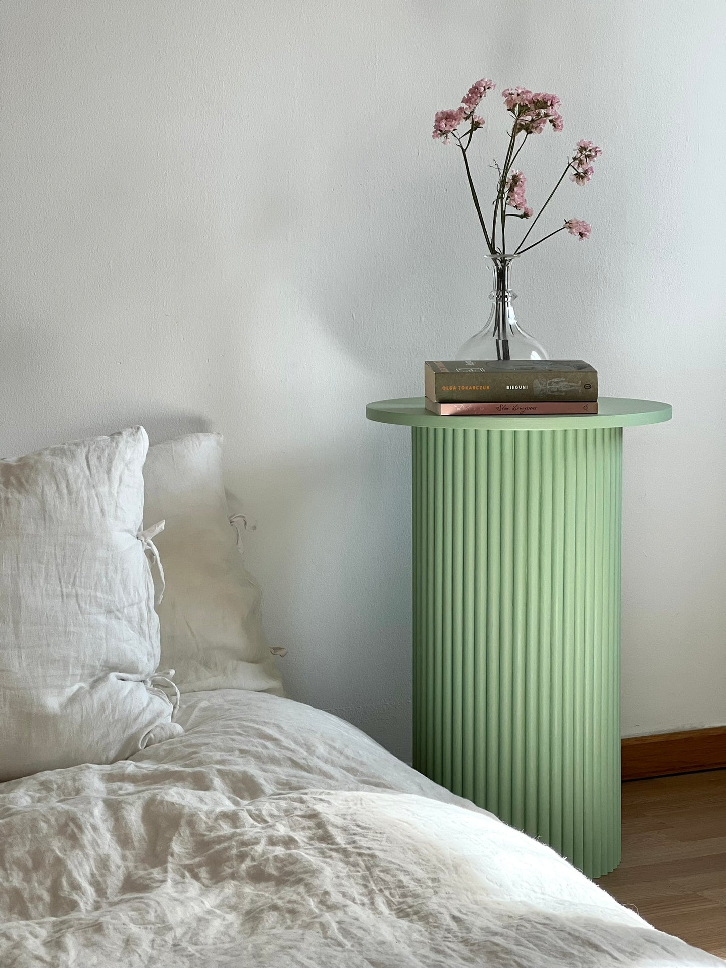 
                  
                    round and fluted bedside table in sage green
                  
                