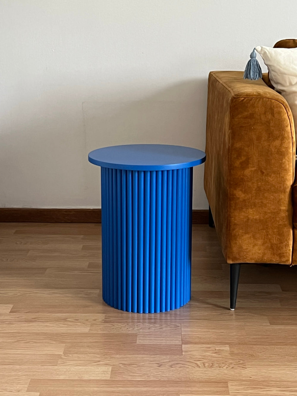 small round and fluted bedside table in klein blue