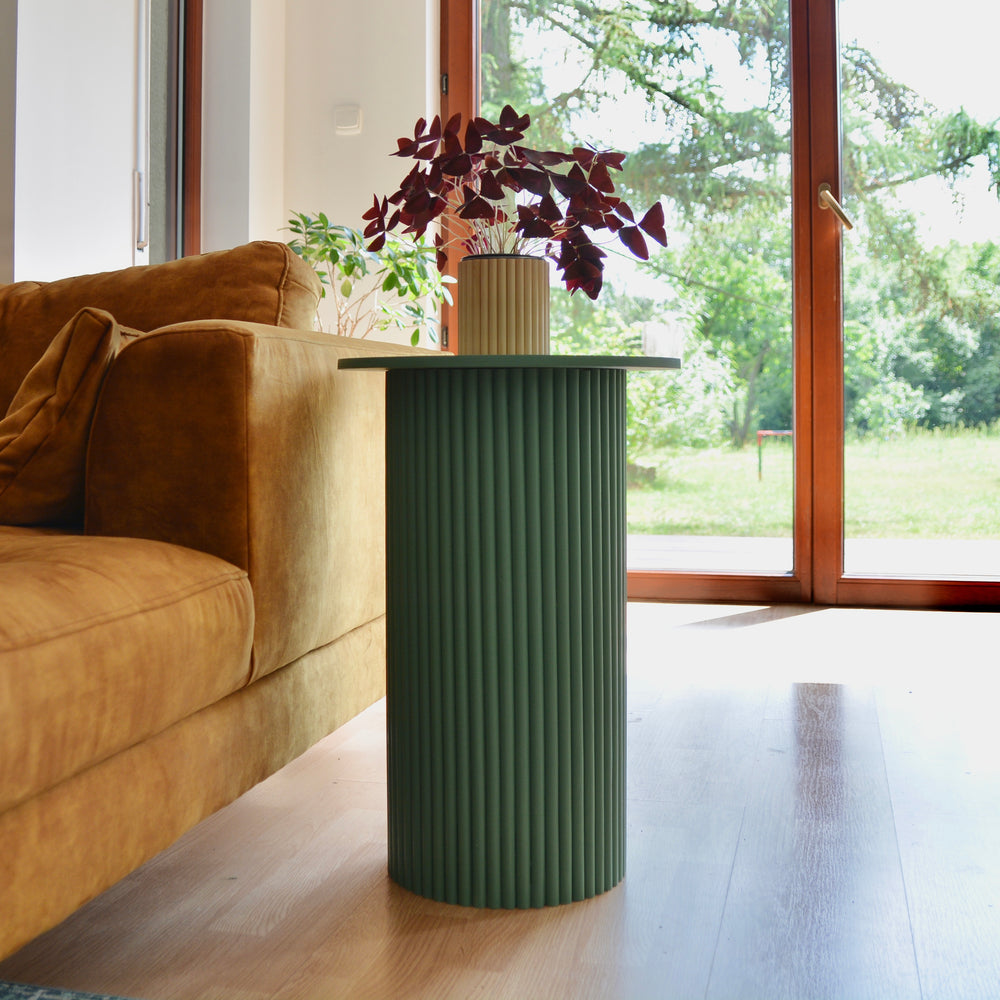
                  
                    round and fluted bedside table in green
                  
                