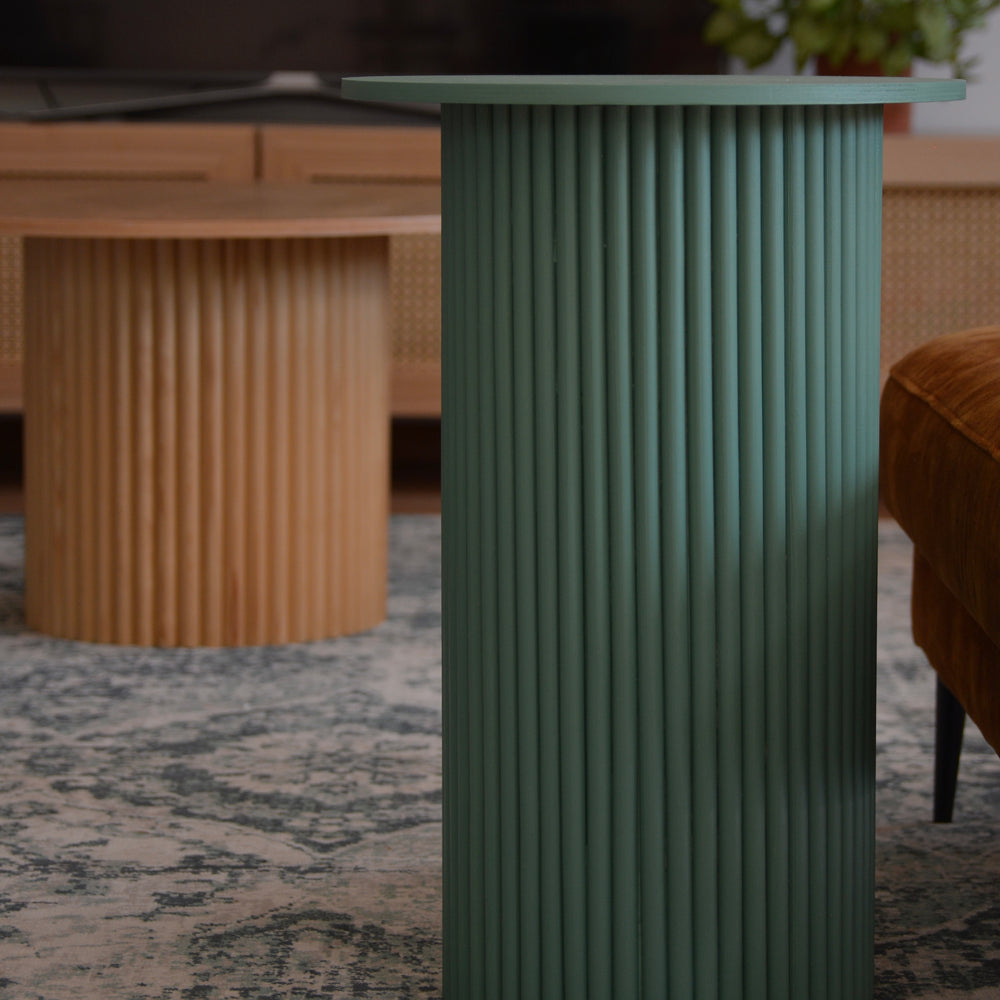 
                  
                    round and fluted bedside table in green
                  
                