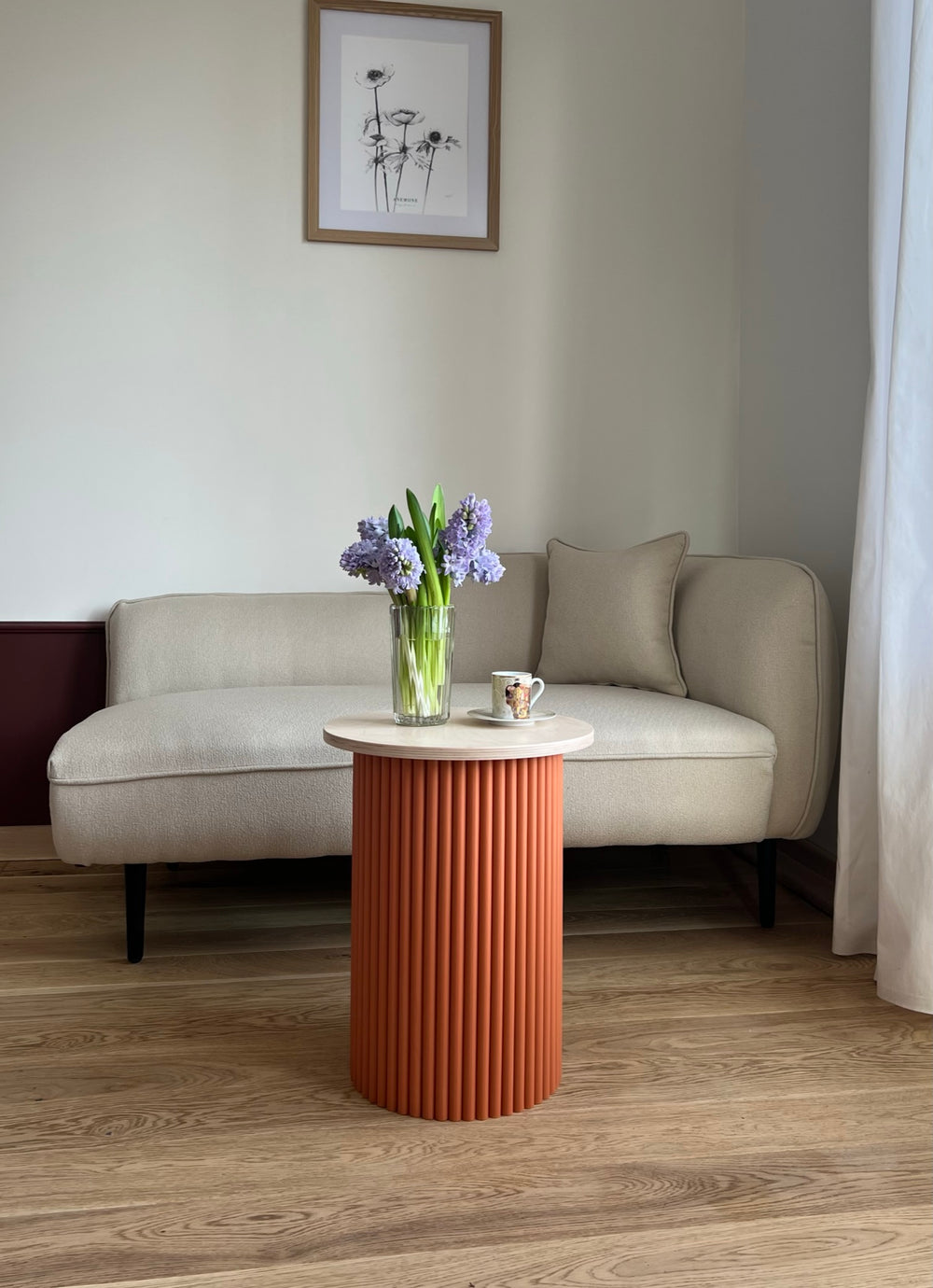 small two-colored round and fluted bedside table