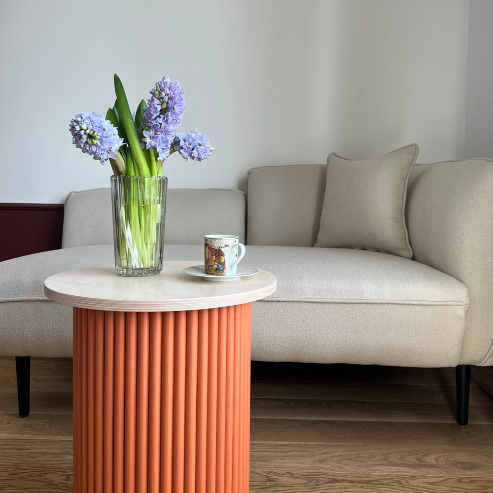 
                  
                    small two-colored round and fluted bedside table
                  
                