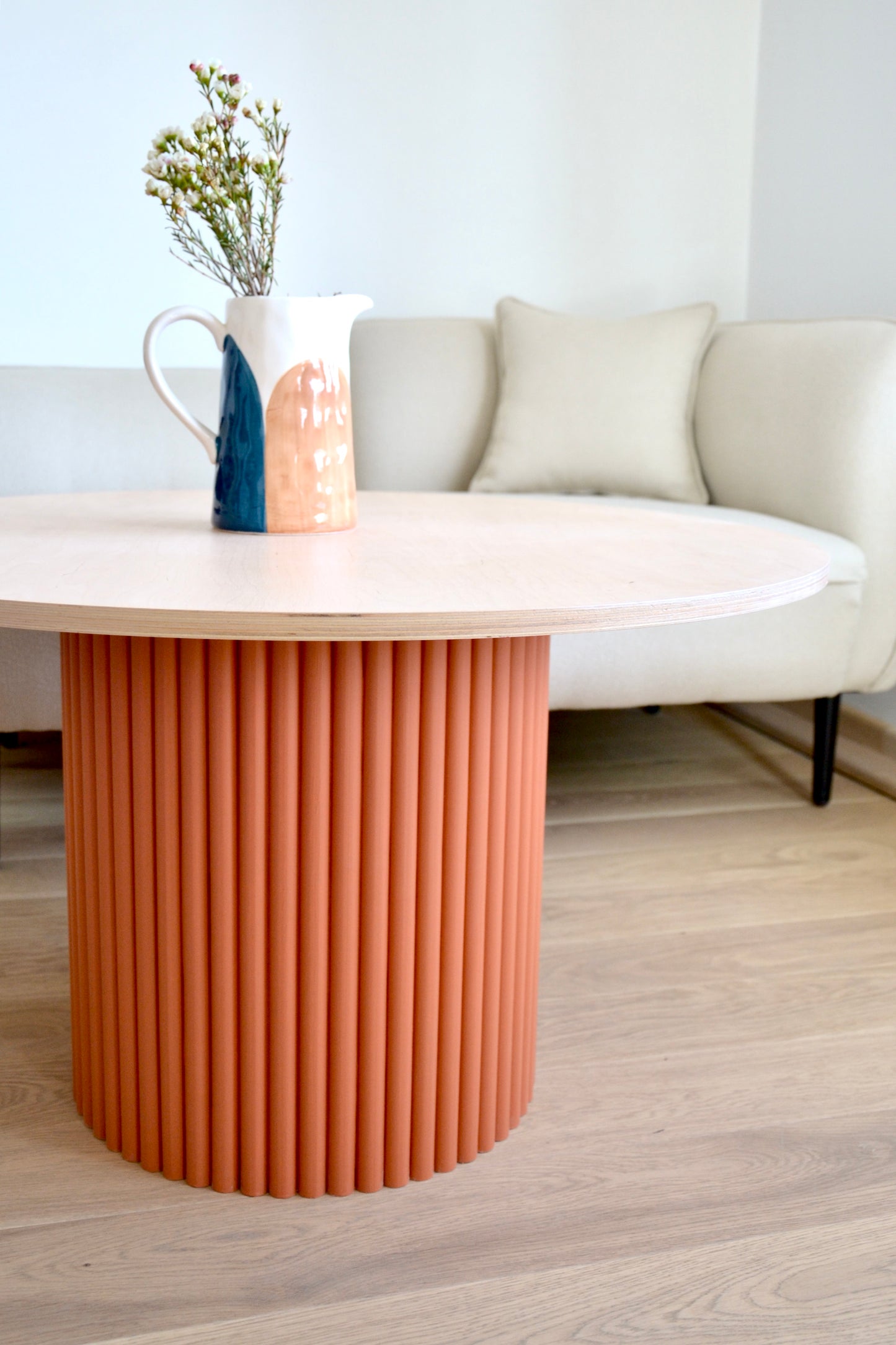 
                  
                    two-colored round fluted coffee table terracotta/natural wood Ø 80 cm
                  
                